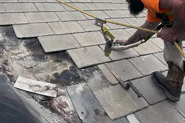 Roof repair services in Central Ohio - KFX Roofing expert fixing slate leaky roof