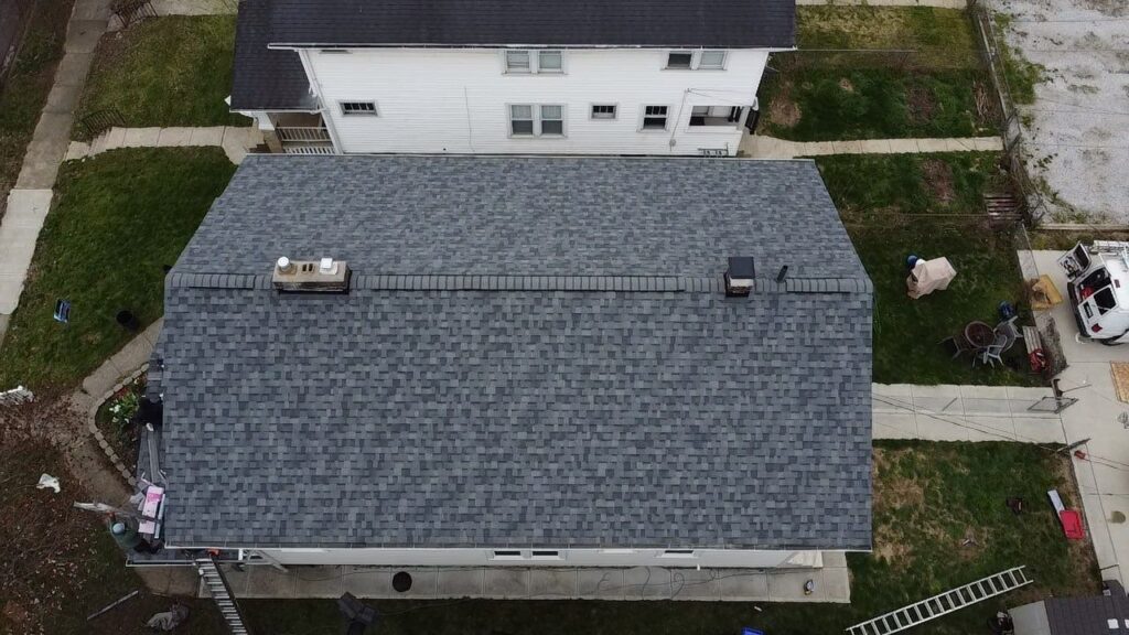 Overhead aerial shot showing a finished roof and its final stages for this residential customer.