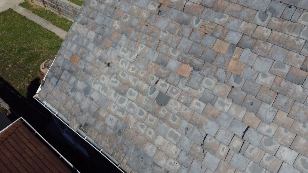 This is the before photo of our pre-inspection of the slate condition, which is clearly terrible and cracked beyond repair.